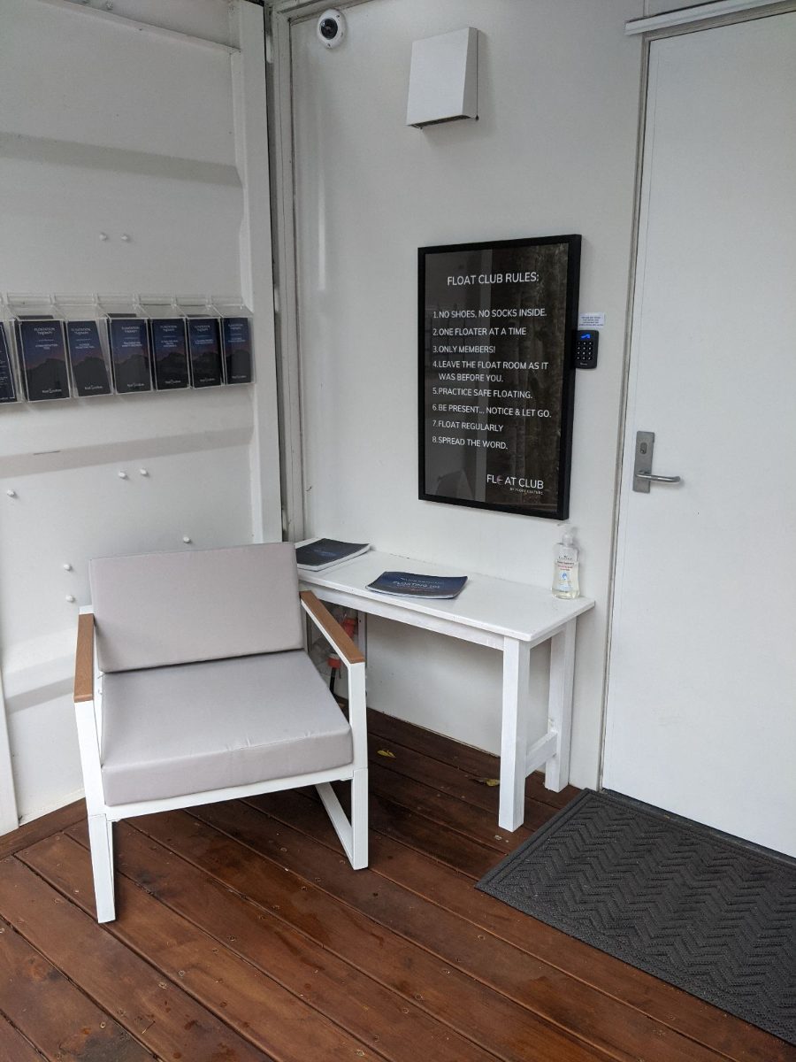 The welcome area with seating, brochures and a keypad-entry door